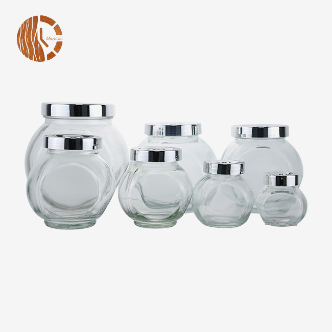 Set of Bulbous Glass Storage Jars with Silver Metal Lids